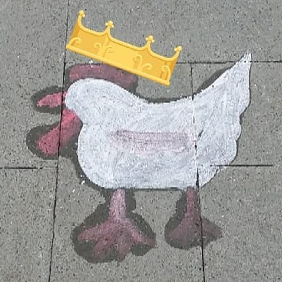 This playful street-art version of King Raymond is drawn in chalk on pavement. His simple white body, red comb, and oversized feet give him a charming, childlike character. A golden crown rests above his head, elevating the humble sidewalk doodle into a royal proclamation of Fringe spirit.